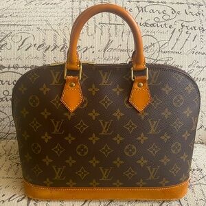 Authentic Louis Vuitton Alma hand bag